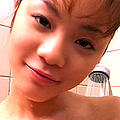 Innocent looking japanese babe gets naked and takes a shower